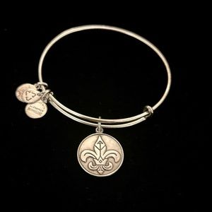 Alex and Ani Fleur De Lis bangle bracelet in gold tone metal.